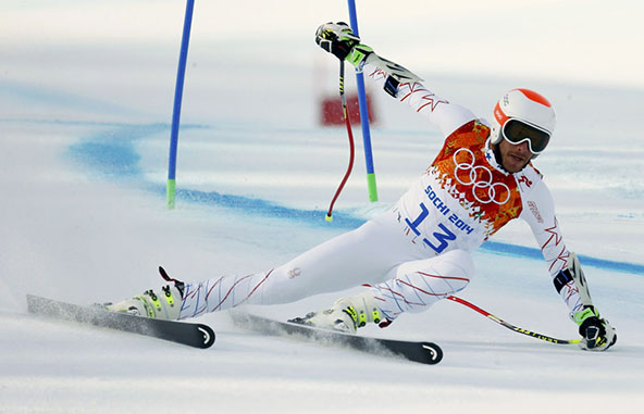 Miller of the U.S. clears a gate during the men's alpine skiing Super-G competition at the 2014 Sochi Winter Olympics